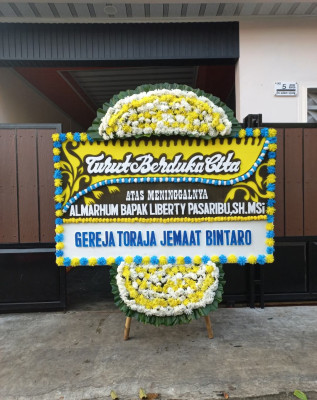 Papan Bunga Duka di Tuak Daun Merah
