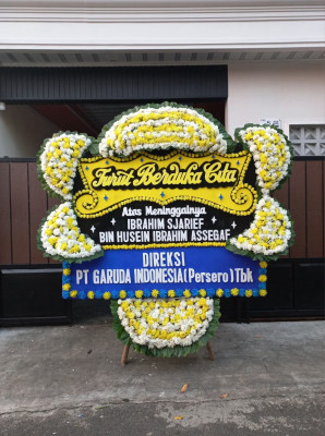 Papan Bunga Duka di Tuak Daun Merah